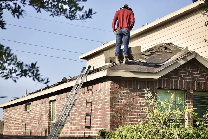 Professional roofer working on a residential roof in Long Grove Country Club Estates